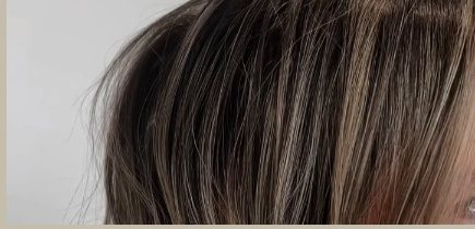 Close-up of blended dimensional highlights near the root