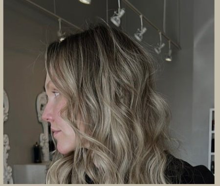 Wavy blonde balayage side profile