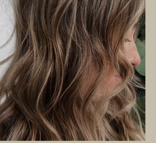 Rich dimensional brunette-to-blonde balayage tones